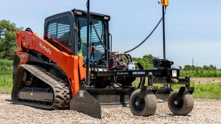 Skid steer equipped for property grading